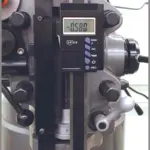 iGaging IP54 Digital Quill Kit mounted on a Bridgeport-type milling machine showing LCD readout and scale